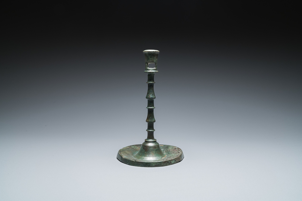 A Dutch or Flemish knotted bronze candlestick, 15th C.