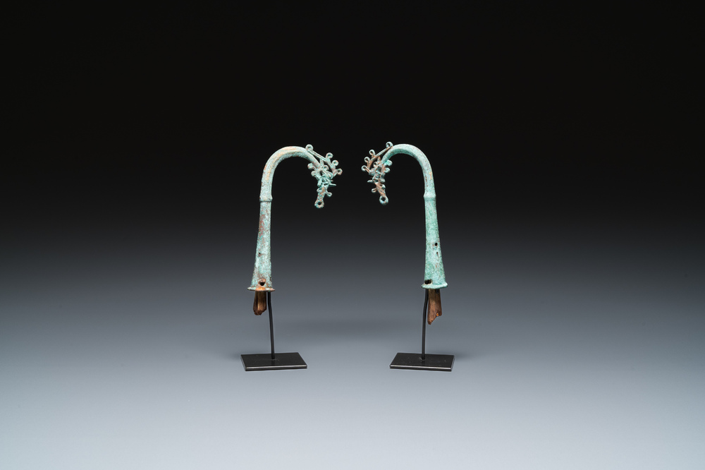 A pair of Chinese bronze finials, Warring States Period, 5th/3rd C. b.C.