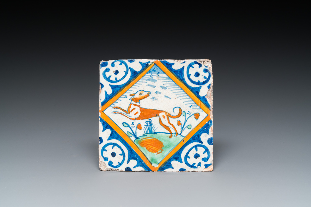 A polychrome Dutch maiolica tile with a dog, ca. 1600