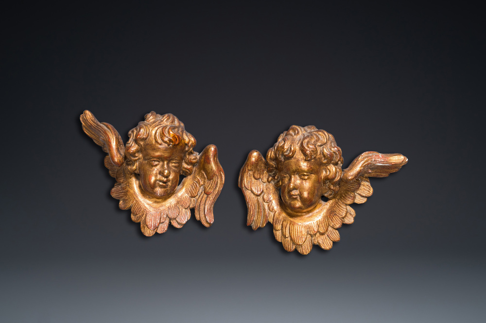 A pair of gilded wooden winged cherub heads, probably Italy, 18th C.