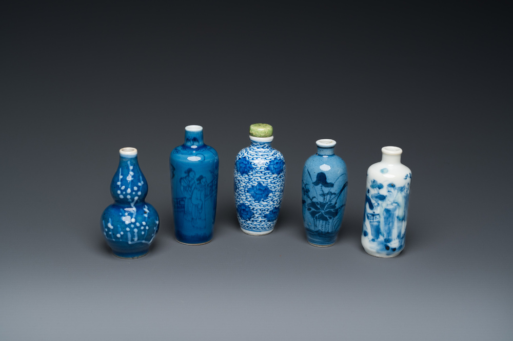 Five Chinese blue and white snuff bottles, 19th C.