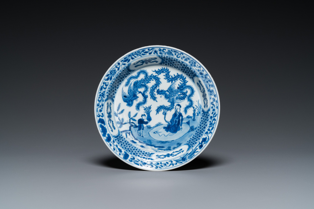 A Chinese blue and white 'two phoenixes and an immortal' plate, Kangxi/Yongzheng