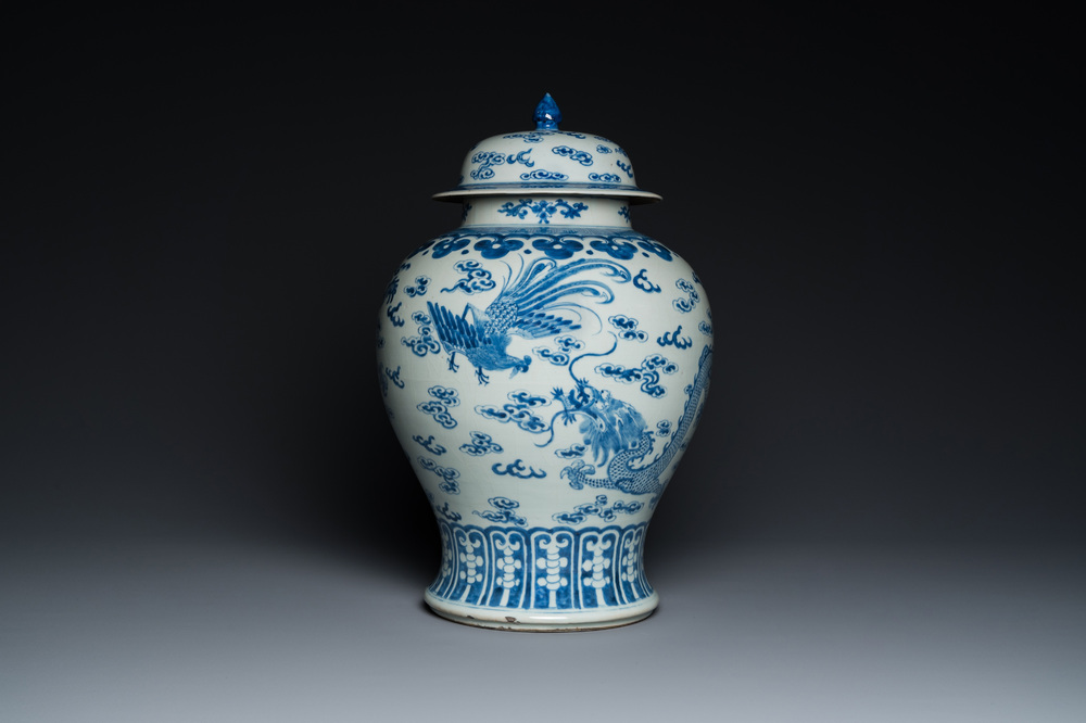 A Chinese blue and white 'dragons and phoenixes' vase and cover, Kangxi mark, 19th C.