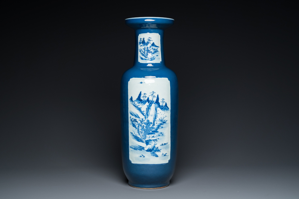 A Chinese blue-ground rouleau vase with blue and white landscape panels, 19th C.
