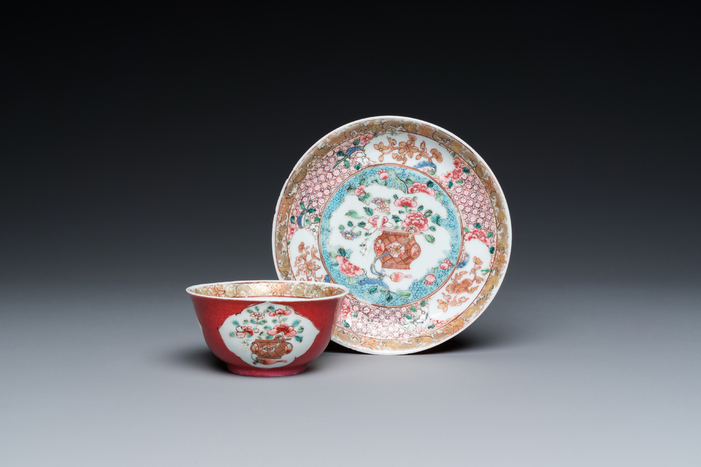 A Chinese famille rose ruby-ground cup and saucer, Yongzheng