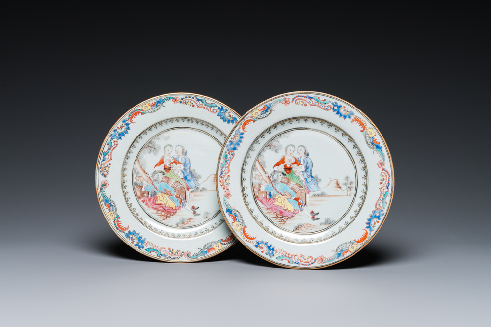 A pair of fine Chinese famille rose plates with a musician playing in front of a couple, Qianlong
