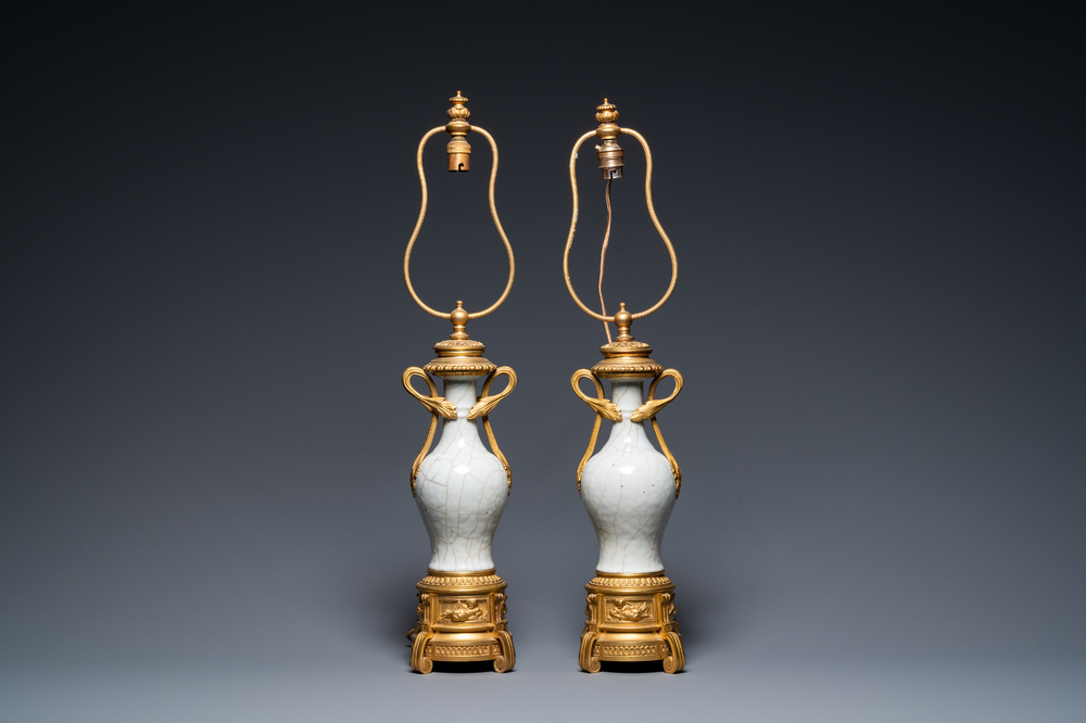 A pair of Chinese gilt bronze lamp-mounted crackle-glazed vases, 18/19th C.
