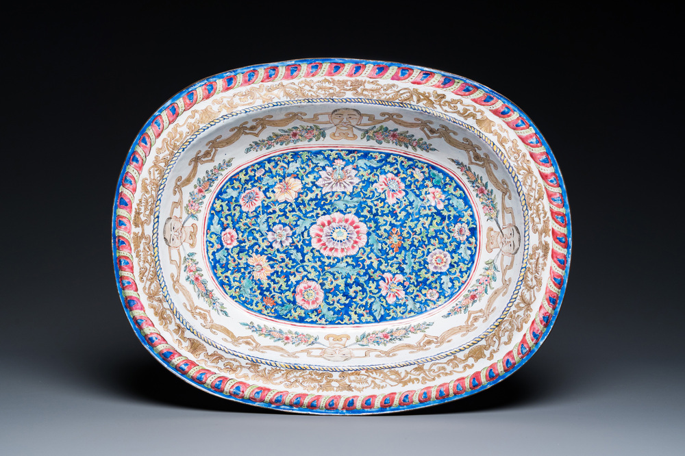 A large Chinese Canton enamel basin with garlands decorated with male heads, Qianlong