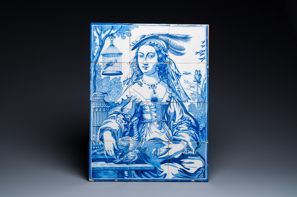 A Dutch Delft blue and white tile mural with a lady and her birds, 19th C.