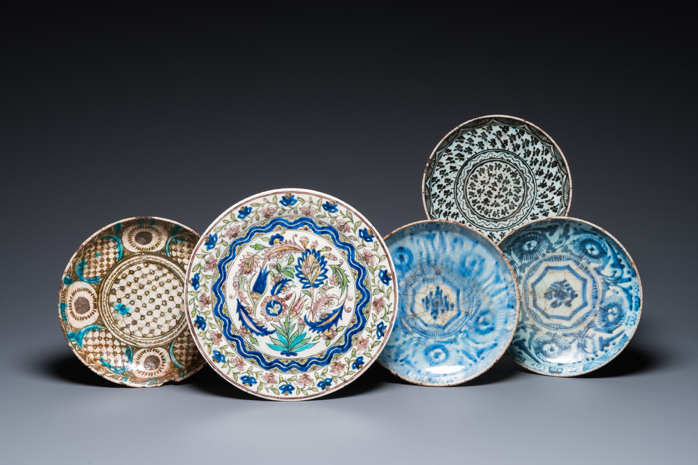 Five blue and white and polychrome Islamic pottery dishes, Qajar, Persia, 19th C.