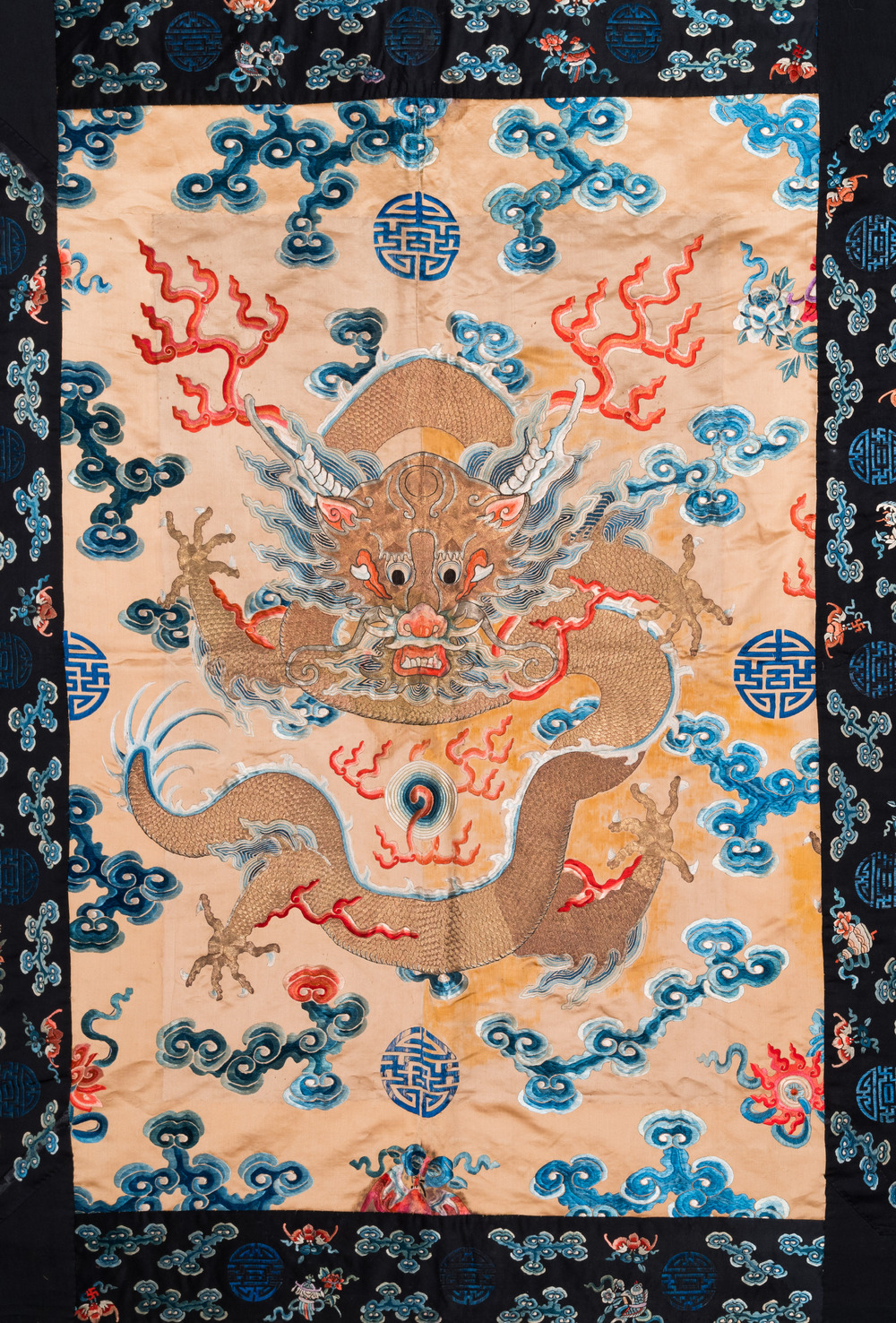 A large Chinese gold-thread-embroidered silk panel with an imperial dragon, 19th C.