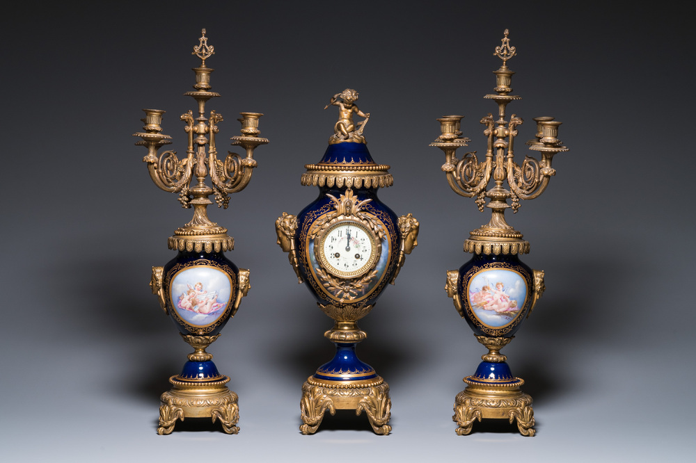 A large three-piece S&egrave;vres-style clock garniture with gilt bronze mounts, France, 19th C.