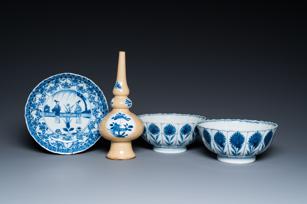 Two Chinese blue and white bowls, a small plate and a caf&eacute;-au-lait ground sprinkler, Kangxi