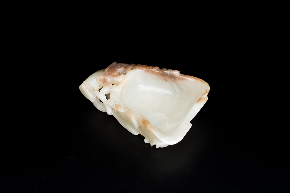 A Chinese white and russet jade lotus-form brush washer, Qing