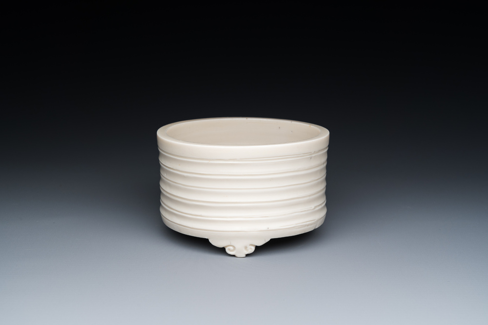 A Chinese Dehua blanc de Chine tripod censer, Kangxi