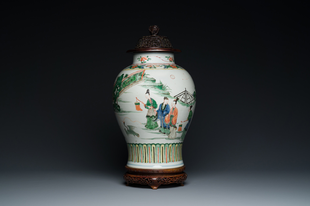 A Chinese famille verte vase with reticulated wooden cover and stand, Kangxi