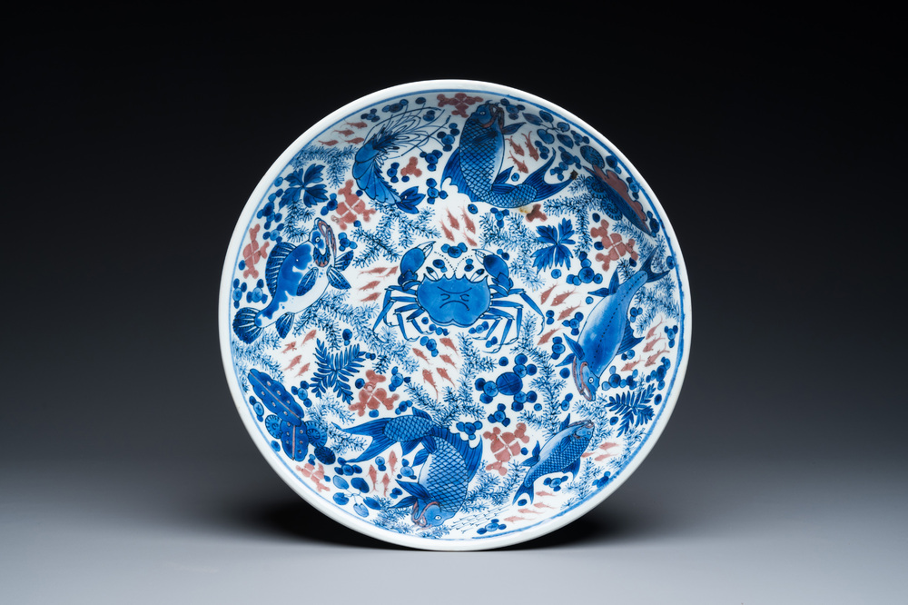 A Chinese blue, white and copper red 'crab and fish' dish, Kangxi