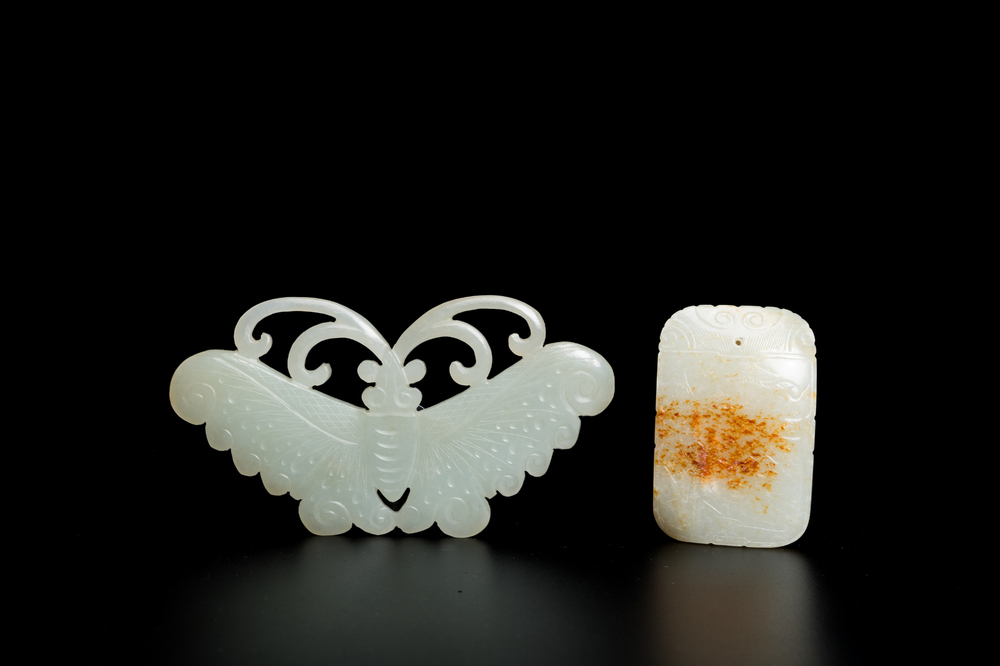 Un pendentif en jade blanc tach&eacute; de rouille et une plaque en forme de papillon en jade c&eacute;ladon, Chine, Qing/R&eacute;publique
