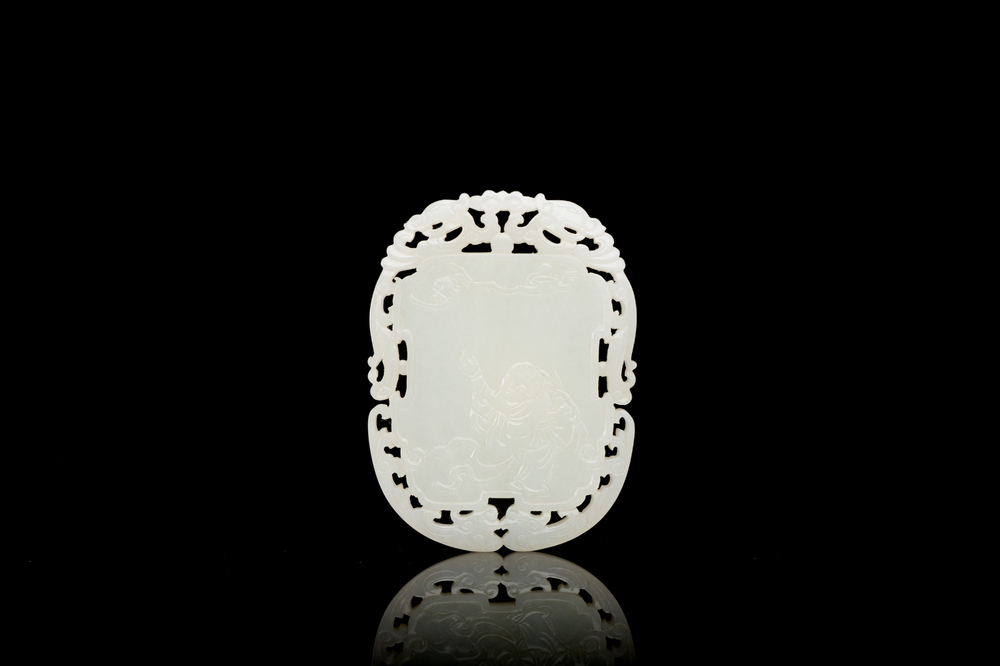 A Chinese reticulated white jade plaque, Qing