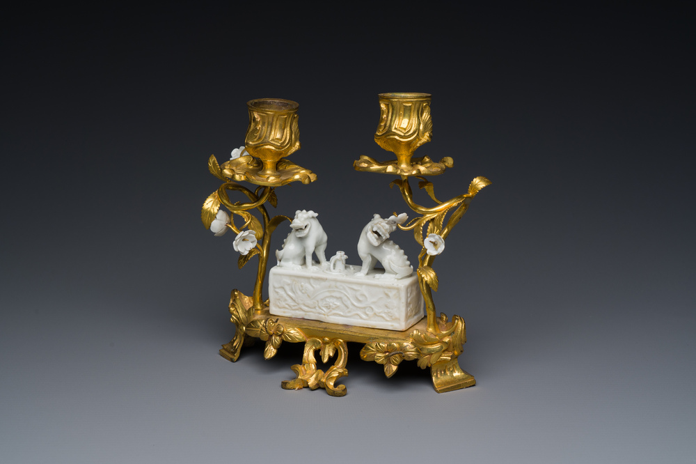 A Chinese Dehua blanc de Chine joss stick holder with French gilt bronze candlestick mounts, Kangxi and 18/19th C.