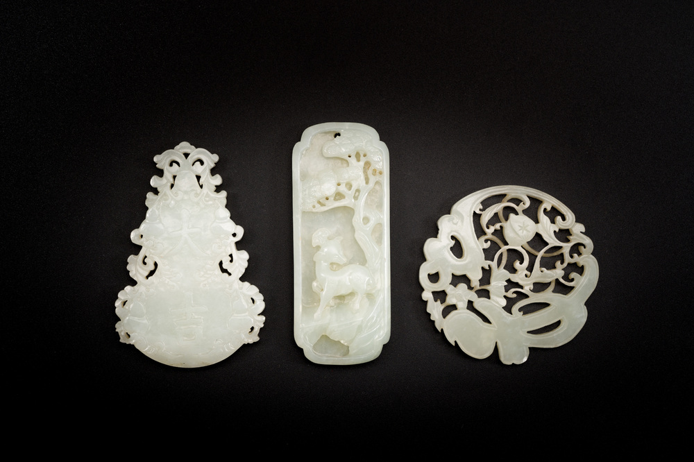 Three Chinese celadon and white jade pendants, Qing