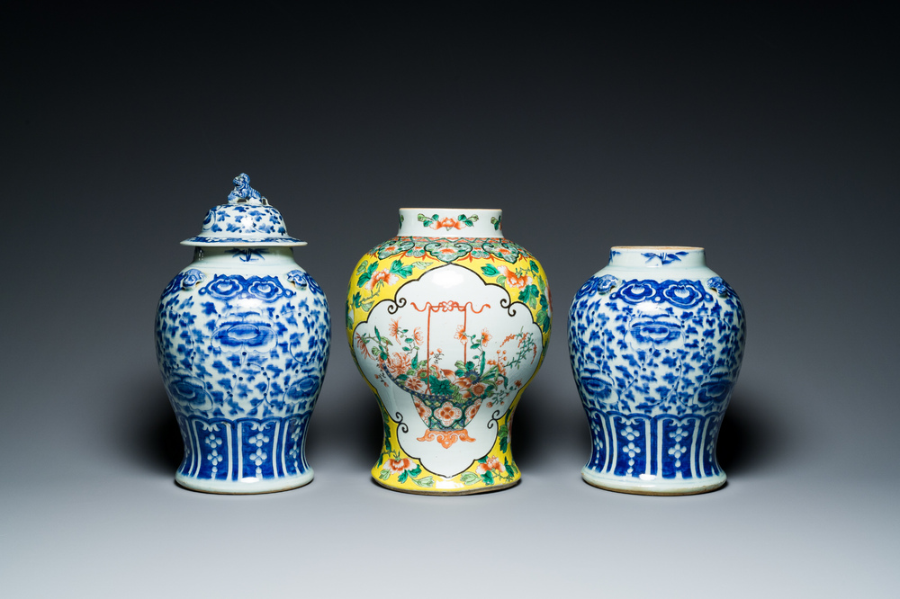 Three Chinese blue, white and famille verte vases, 19th C.