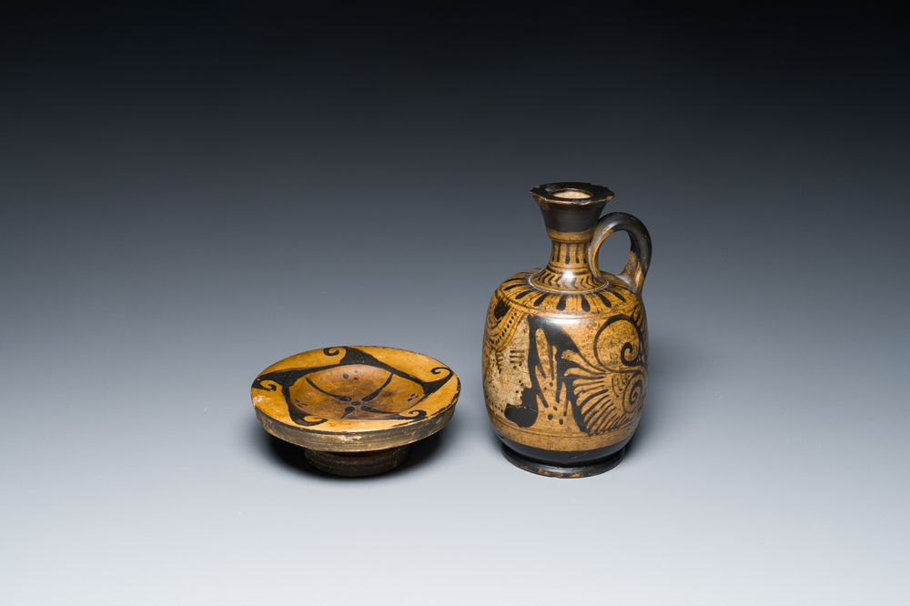 An Etruskian 'aryballos' portrait ewer and a 'patera' dish with black geometrical design, 4th C. b.C.