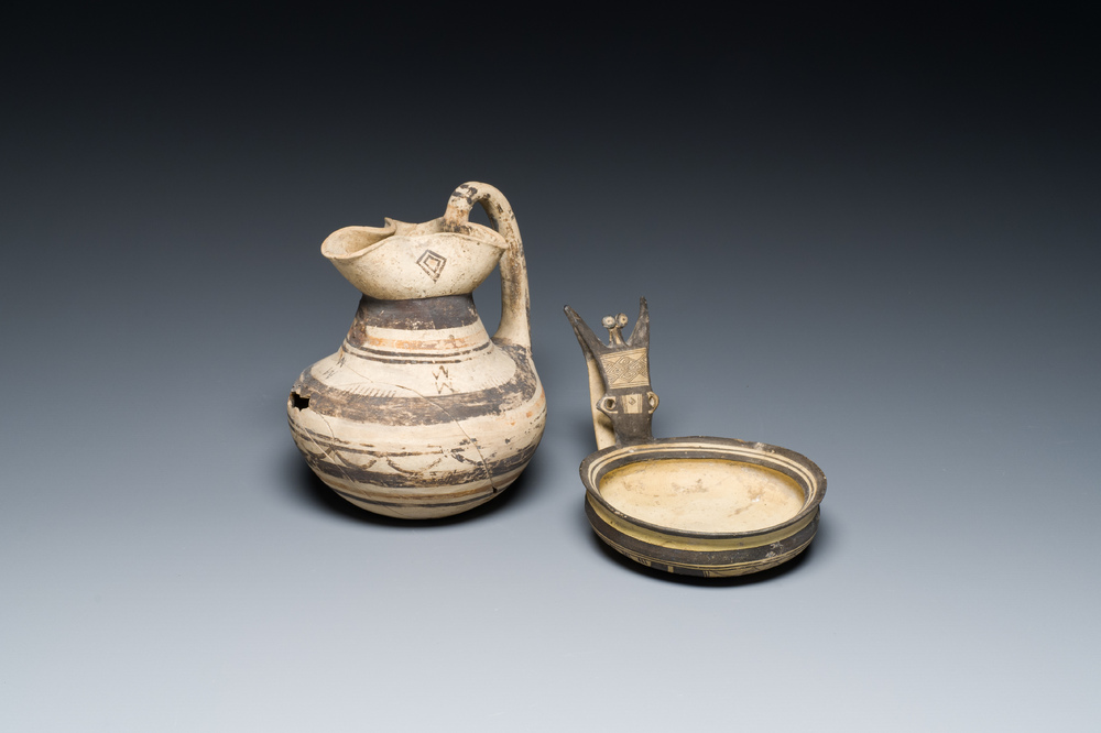 A polychrome Greek pottery 'oinochoe' ewer and a geometrically decorated Daunian pottery bowl, Southern Italy, 6th/3rd C. b.C.