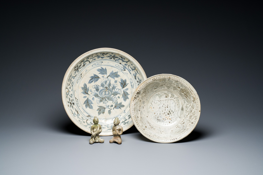 A Vietnamese or Annamese blue and white dish, a Thai Sawankhalok dish and a pair of celadon figures, 14th C. and later