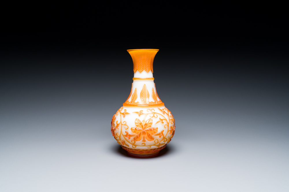 A Chinese overlay Beijing glass bottle vase with lotus scrolls in yellow on white, 19t/20h C.