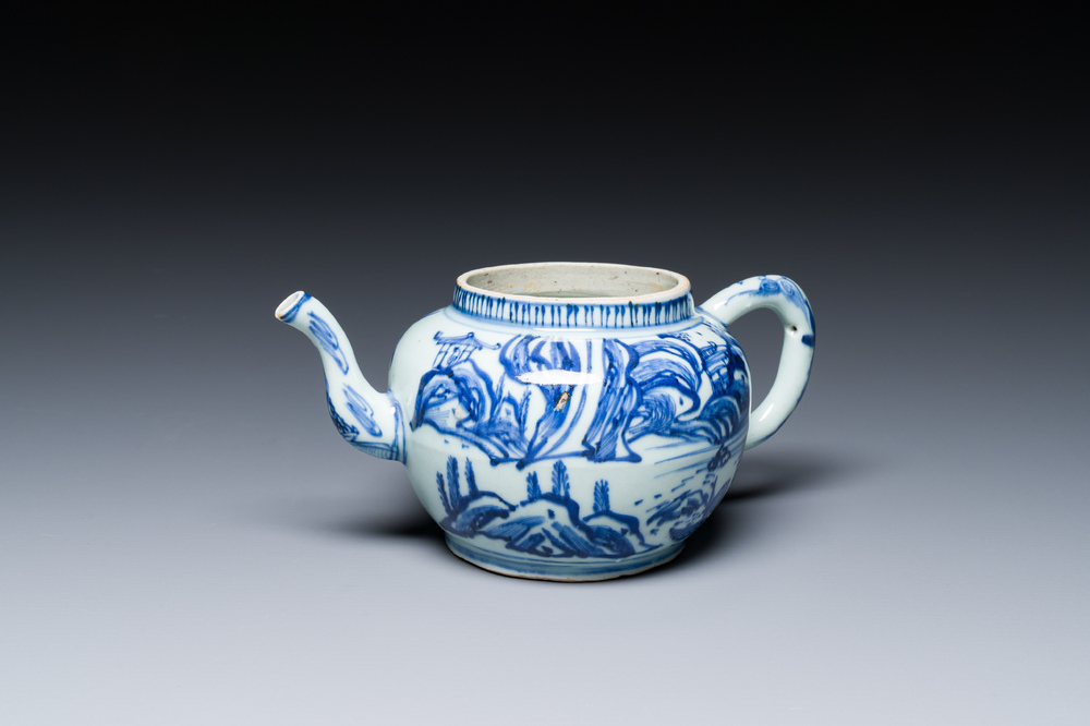 A Chinese blue and white teapot with a mountainous landscape, Transitional period