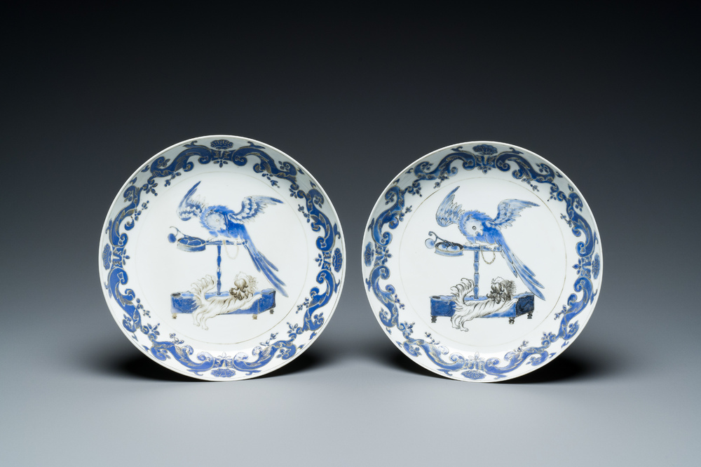A pair of Chinese eggshell Pronk studio 'parrot and spaniel' plates, Yongzheng/Qianlong