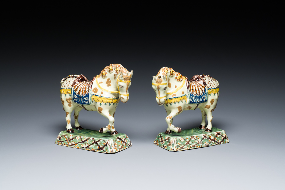 A pair of polychrome Dutch Delft standing horses, 18th C.