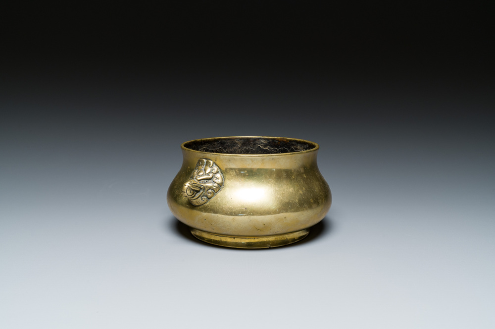A Chinese bronze elephant-head-handled censer, Xuande mark, Kangxi/Qianlong