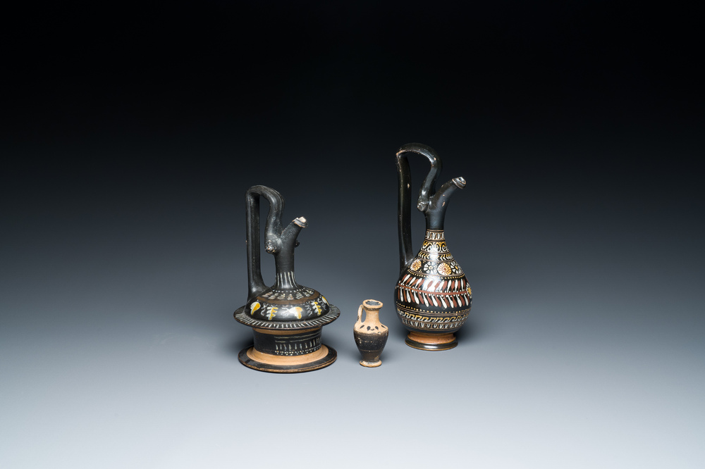 A polychrome Greek pottery 'oinochoe' ewer, an 'epichysis' ewer and a small vase, 5th/3rd C. b.C.