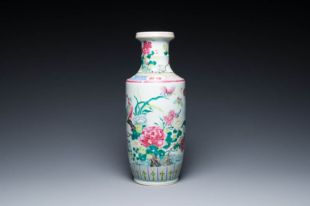A Chinese famille rose rouleau vase with a parrot among blossoming branches, 19th C.