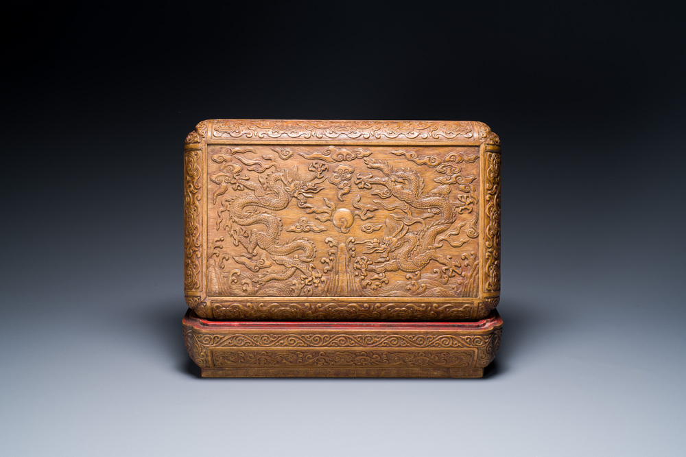 A Chinese rectangular huanghuali wooden box and cover with dragons, 17/18th C.