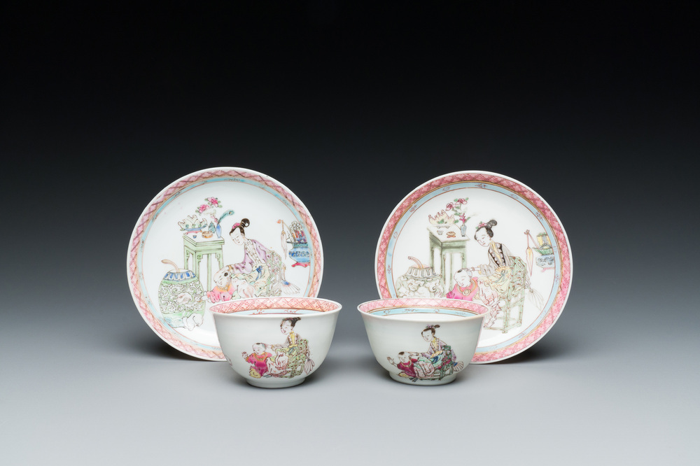 A pair of Chinese famille rose cups and saucers with a lady and a boy, Yongzheng