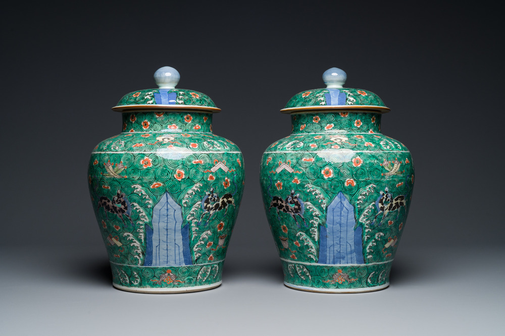 A pair of Chinese famille verte 'galloping horses' vases and covers, 19th C.