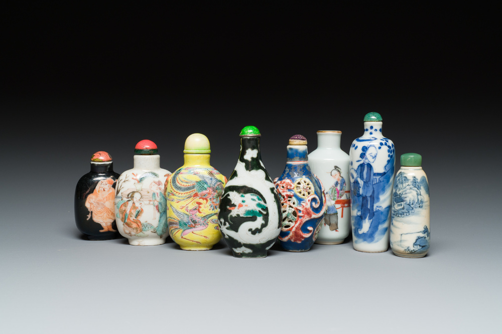 Eight Chinese blue and white, famille noire and famille rose snuff bottles, various marks, 19th C.
