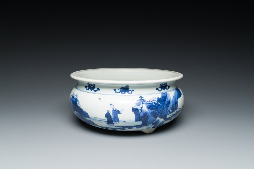 A Chinese blue and white tripod censer with figures in a mountainous landscape, Kangxi