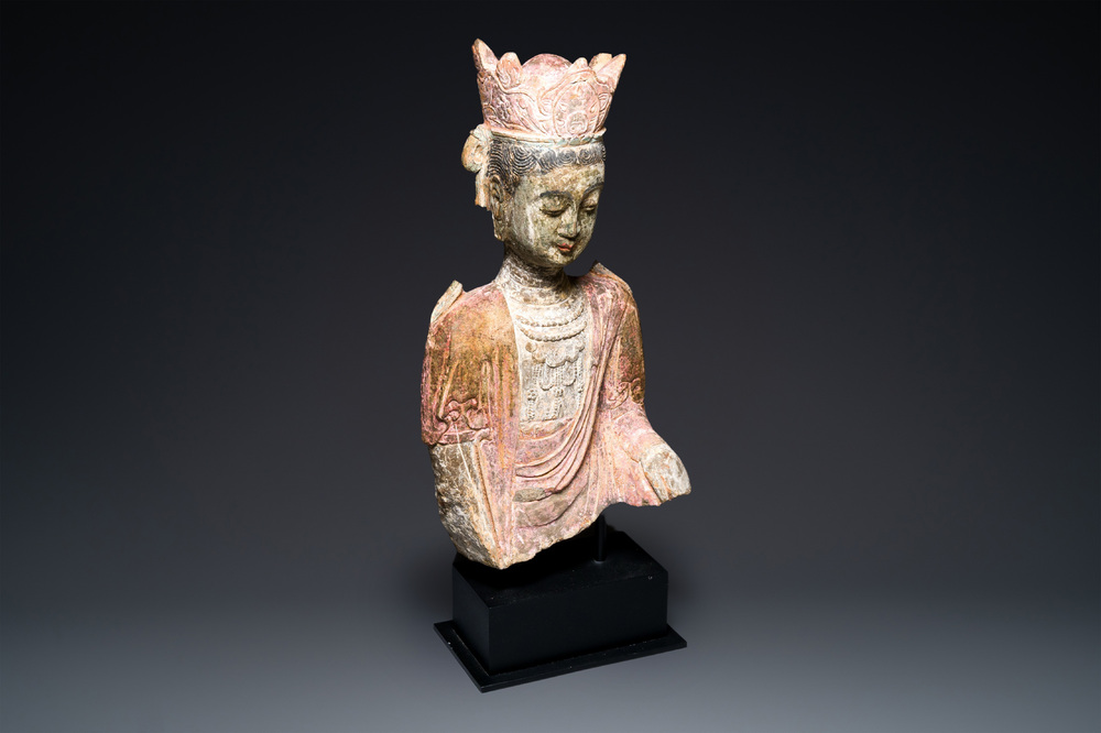 A Chinese polychromed stone sculpture of Guanyin, probaby Yuan/Ming