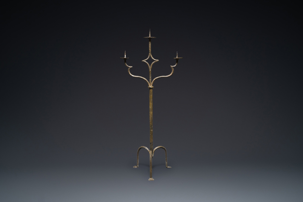 A large French gothic wrought iron three-lights candlestick, ca. 1500