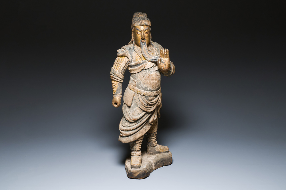 A large Chinese partly gilded and polychromed wood sculpture of Guandi, 17th C.