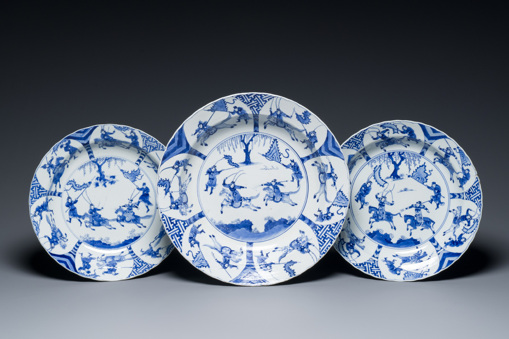 Three large deep Chinese blue and white 'hunting scene' dishes, Chenghua mark, Kangxi