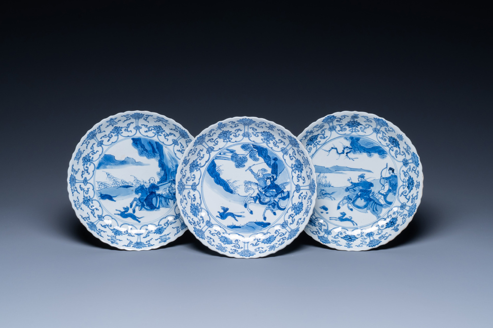 Three Chinese blue and white 'Mongolian hunt' plates, Chenghua mark, Kangxi
