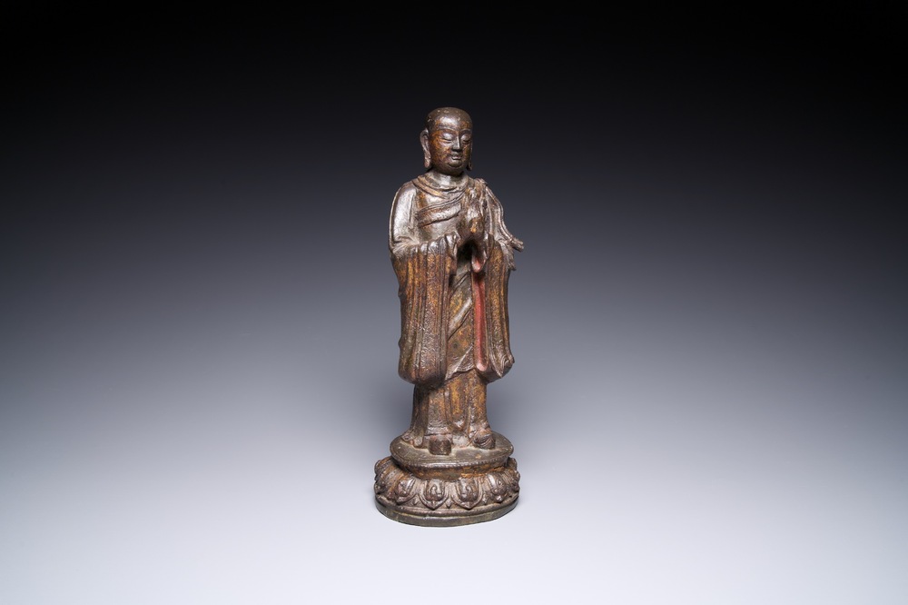 A Chinese gilt bronze standing Buddha, Ming