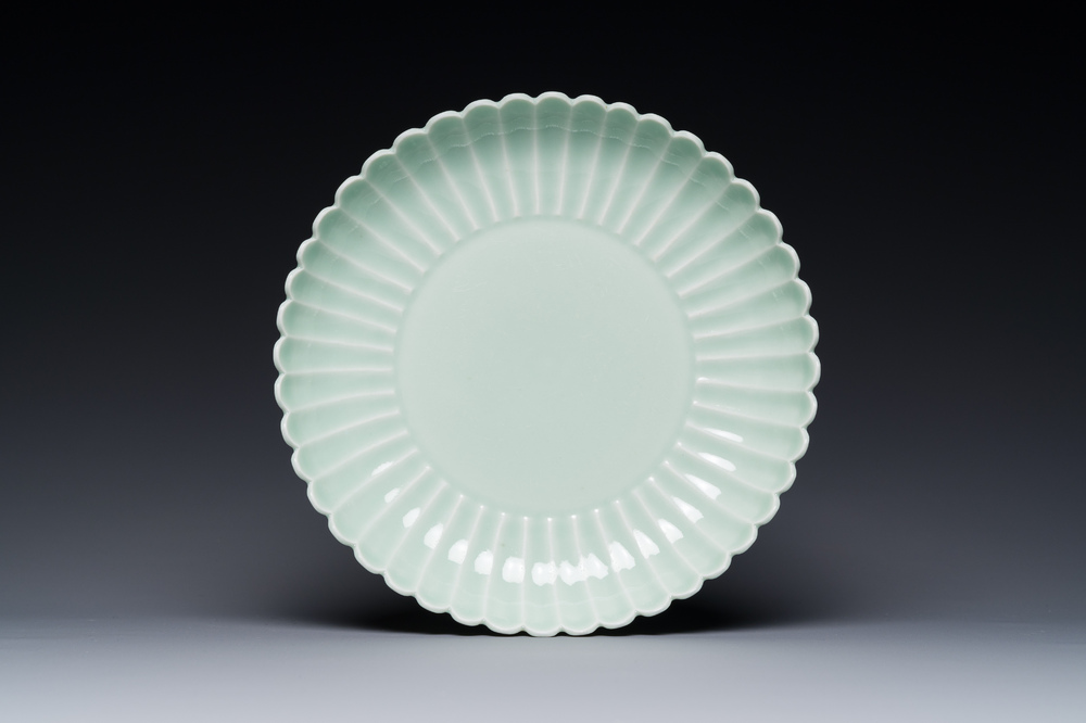 A Chinese celadon-glazed chrysanthemum-shaped plate, Qianlong mark, 20th C.