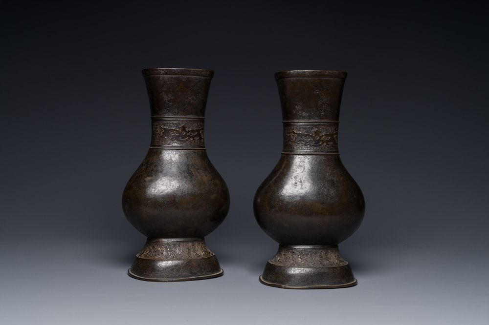 A pair of Chinese bronze 'hu' vases with Taotie design, Song/Yuan