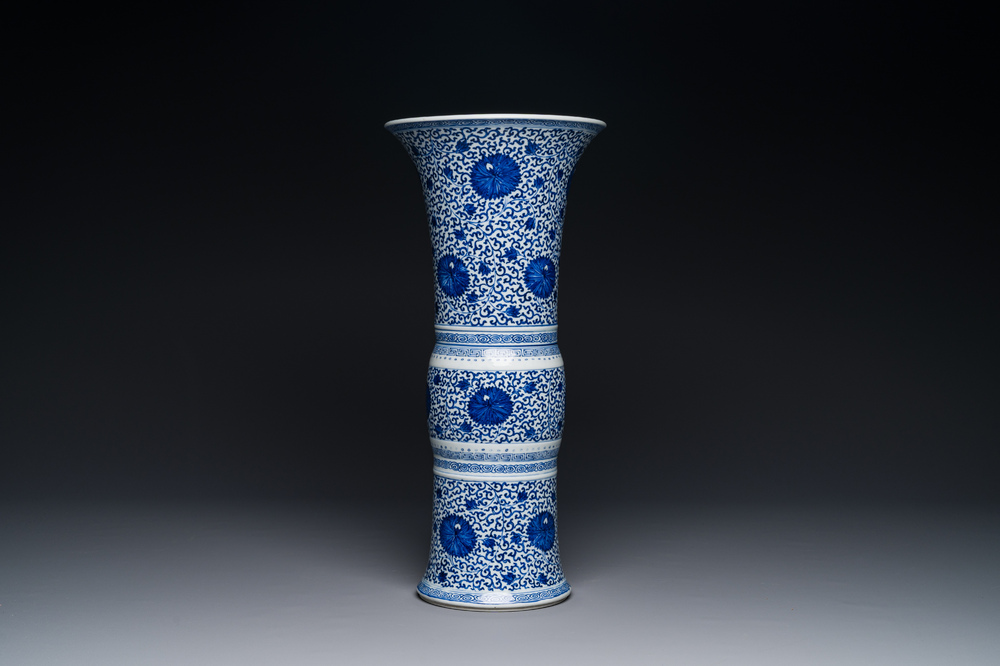 A Chinese blue and white 'chrysanthemum scroll' 'gu' vase, Kangxi